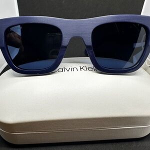 Calvin Klein Sunglasses in a blue matte color.